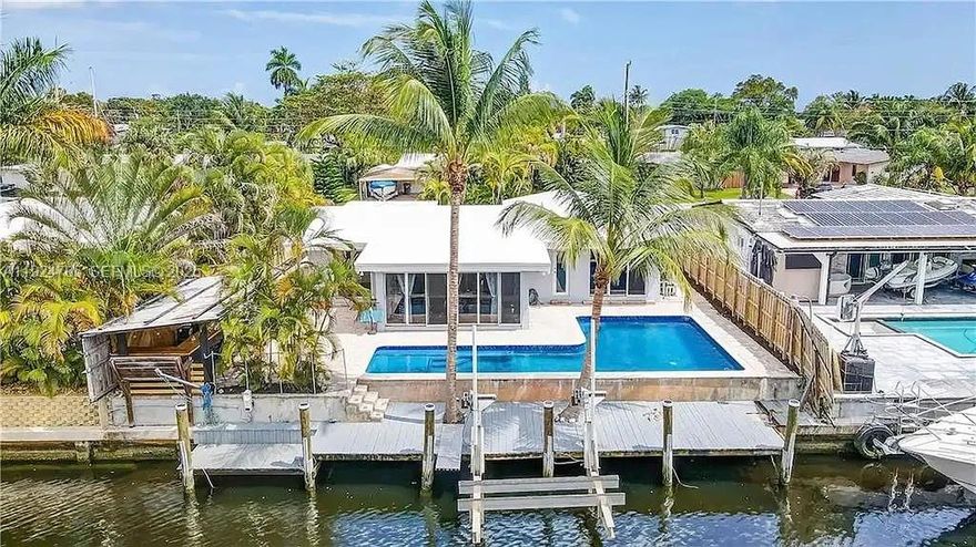 Welcome to your ideal waterfront home in beautiful Fort Lauderdale—fully furnished and designed for a stress-free, memorable stay! This 3-bedroom, 2-bathroom home offers the perfect combination of comfort, convenience, and resort-style amenities. Ocean access with a bock fir up 65 foots BOAT with no bridges. Relax in your private backyard oasis featuring a heated pool, BBQ grill, and a charming tiki bar—perfect for outdoor dining, entertaining, or simply unwinding as boats pass by. Inside, the home offers a spacious, open-concept layout with comfortable seating, a fully equipped kitchen, and stylish décor throughout, making it easy to feel right at home. This rental provides everything you need for a comfortable stay—from ample indoor living space to premium outdoor amenities. Plus, you're just 10 minutes from the renowned Hard Rock Hotel & Casino, giving you quick access to world-class dining, entertainment, and nightlife.