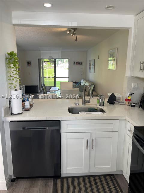 Photo of 10434 Sunrise Lakes Blvd #107, Sunrise, FL 33322 (MLS # A12061641)
