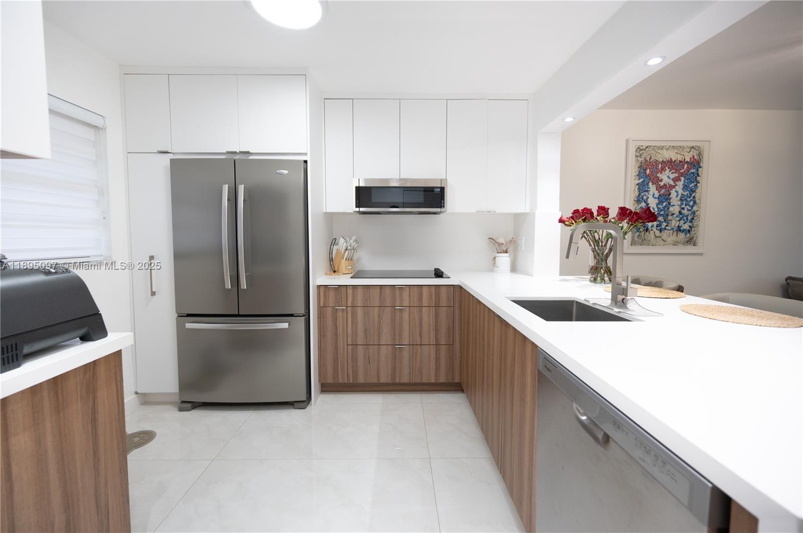 Beautifully upgraded 2bed/2-bath condo on the second floor in the desirable Gardens of Kendall South community. This home has been fully remodeled throughout, featuring elegant ceramic tile floors, completely renovated bathrooms, a modern kitchen, and an in-unit washer and dryer for ultimate convenience. Enjoy a bright, open layout, one assigned parking space, and plenty of guest parking. Small pets are welcome (1 pet up to 10 lbs). The community offers excellent amenities, including a swimming pool and tennis courts. Prime location near Miami Dade College, major highways, shopping, and dining. Perfect combination of comfort, style, and convenience. Available for move-in on December 1st, schedule your showing today!