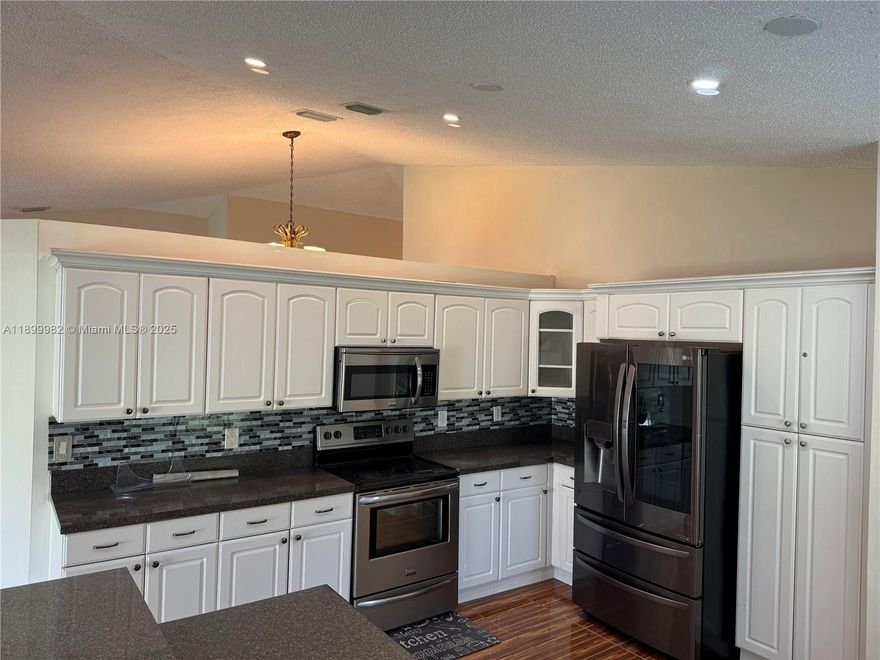 Welcome to this spacious 4-bedroom, 2-bathroom home, 2 car garage, nestled in the serene neighborhood of Amber Lakes. As you step inside, you're greeted by a bright and airy living space adorned with large windows, illuminating the room with natural light. The kitchen boasts modern appliances, ample cabinetry, and a convenient breakfast bar, perfect for morning gatherings. The master suite offers a peaceful retreat with a luxurious en-suite bathroom featuring a soaking tub and separate shower. Three additional bedrooms provide flexibility for guests or a home office. Outside, a sprawling backyard for outdoor activities and relaxation, complete with lush greenery and plenty of space for entertaining. Don't miss out on this ideal blend of comfort and tranquility in the heart of Amber Lakes.