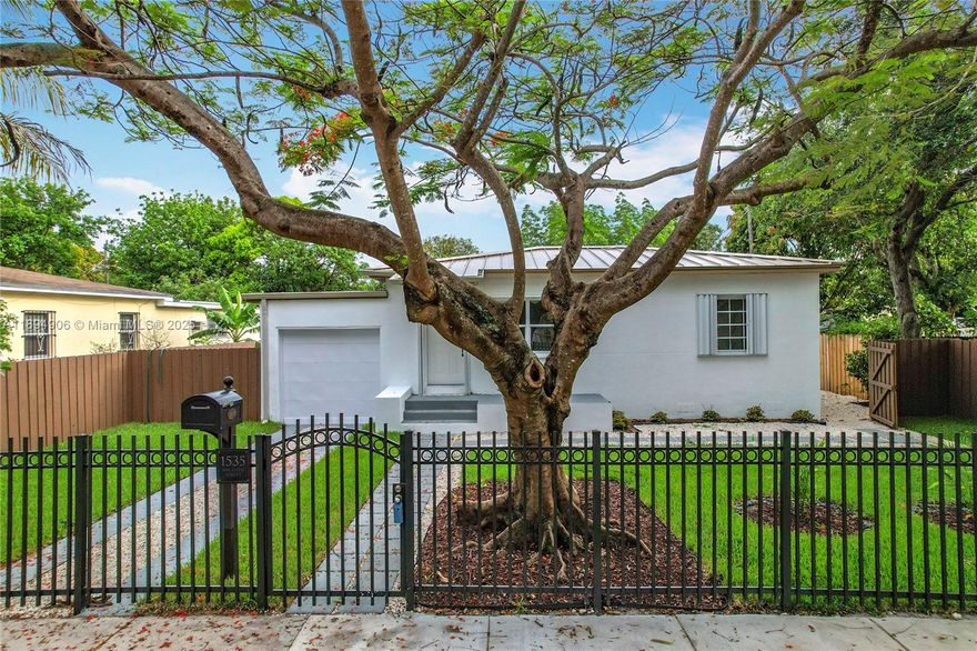 Welcome to this beautifully renovated gem in North Miami! It features a durable metal roof (2022), new central A/C, recessed lighting, high-end stainless steel appliances, and quartz countertops. The open layout offers flexibility to grow—perfect for first-time buyers or investors. Enjoy a spacious backyard with a beautiful pergola, rear alley access, and a large gate with room for RVs, boats, or even an ADU. The front fence provides extra security. Conveniently located just minutes from I-95, 826, SR 7, and I-75. No HOA!