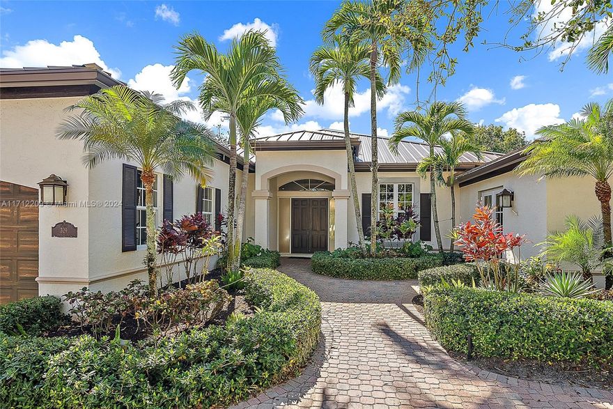 Paradise in Admirals Cove on almost 1/2 acre, with a large side yard to expand or enjoy all that Florida has to offer. This home has 4 bedrooms, 3.5 baths, 2.5 garage, air conditioned workshop that could be a garage or converted to a guest suite, updated kitchen with stainless steel appliances, custom countertops, new roof in 2023 and much much more! Very spacious Primary suite with sitting area overlooking the pool and beautifully landscaped backyard. This home is the perfect blend of function and style.