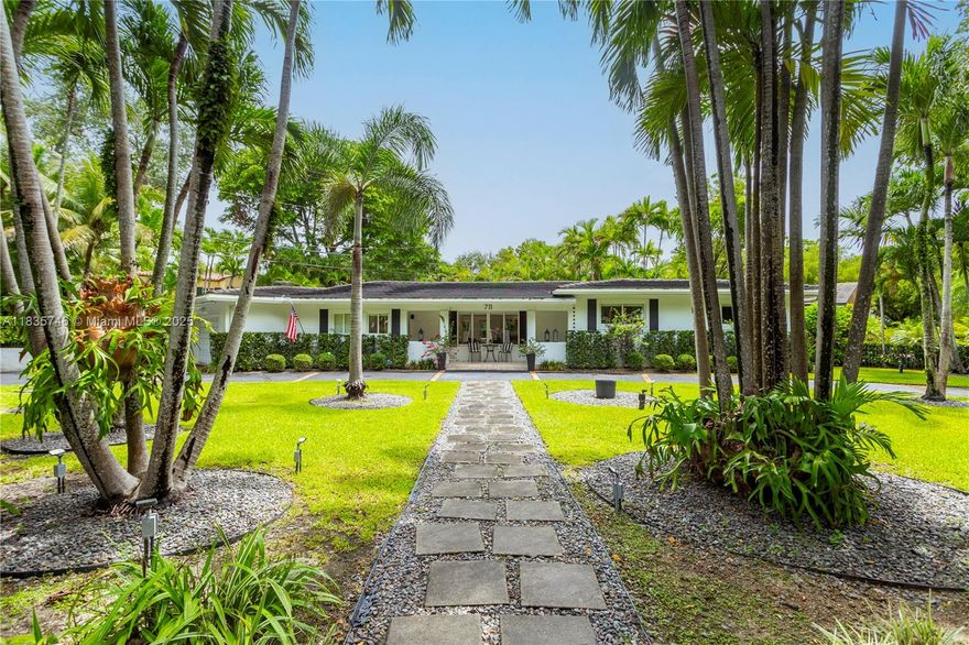 Beautifully Renovated South Gables home with LARGE entertaining spaces on a spacious 12,700 SF corner lot! This home blends modern style with Coral Gables charm. Renovated in 2021, it features high 9+ ft ceilings in the main living spaces and a spacious open floor plan perfect for entertaining. Enjoy a sleek kitchen with peninsula, updated baths, impact windows/doors, and polished original wood floors in the bedrooms. The primary suite offers two large closets + a modernized bathrooms. Outside, relax in the saltwater pool with heated spa, summer kitchen, and lush landscaping. Additional ftrs: 2010 roof, PVC plumbing, whole-house generator, completely fenced yard with motorized gates. Close to all the top schools and across the street from $10M+ estates!