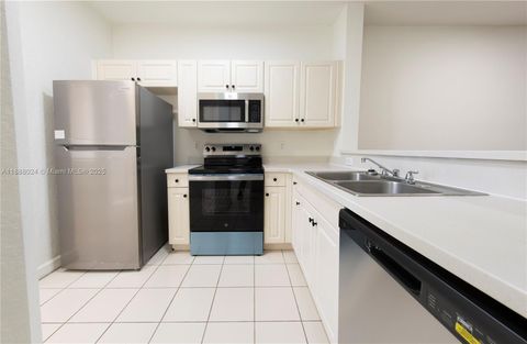 Photo of 4130 Napoli Lake Dr, Riviera Beach, FL 33410 (MLS # A11888024)