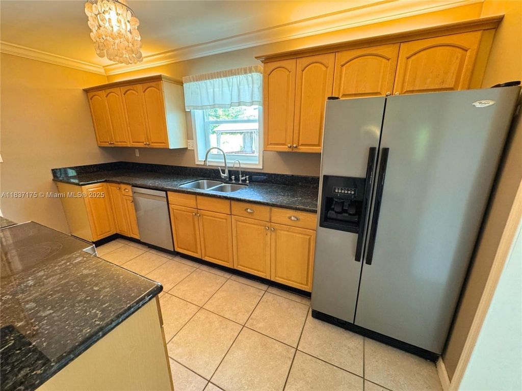 Photo of 813 Date Palm Dr, Lake Park, FL 33403 (MLS # A11837175)