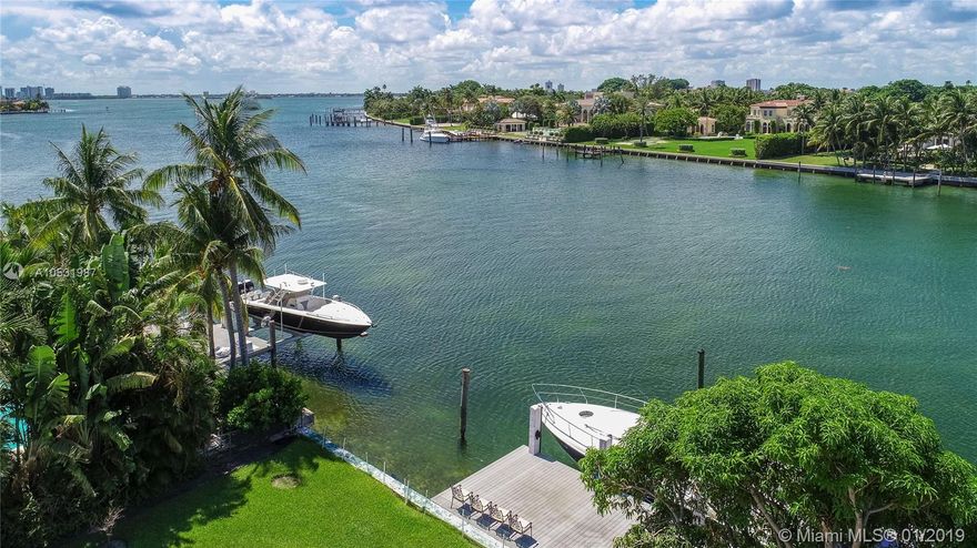 First time on the market! A large, 6,954-sf home situated on a double waterfront lot with 19,750-sf of land and 100 feet of waterfront overlooking the serene water and the lush Indian Creek Village. This is the perfect renovation project! Situated on the large lot is a 1957 home with 4 bedrooms and 4.5 baths, including a huge master suite with an office, large living room with an entertainment bar, and a kitchen with a family room. The property has a 2-car garage, a circular driveway, a new pool with a spa, and a large dock. Renovate the existing home or build your new home on this premier lot on Biscaya Drive in Surfside, and nearby the Bal Harbour shops.