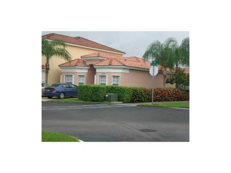 THIS ONE STORY TOWNHOUSE HAS AN OPEN SPACE LAYOUT,HAVING A SPLIT FLOOR PLAN,SPACIUOS DINNING / LIVING ROOM AREAS!!! HURRICANE ACCORDION SHUTTERS THROUGHOUT !! TILE THROUGHOUT THE ENTIRE HOME!!!OWNER KEEPING IT IN A MINT CONDITION!!!NO NEGIHBORS ON THE SID E OR IN THE BACK!!!VERY PRIVATE.BRAND NEW LAMINATE FLOORS.