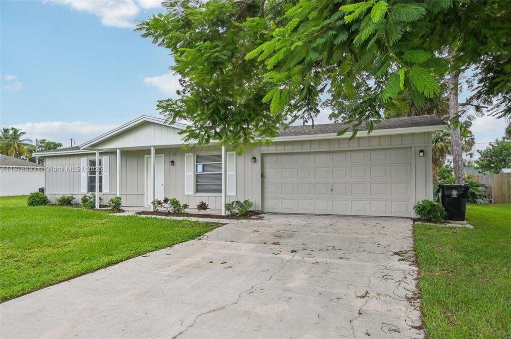 Photo of 412 NW Cornell Ave, Port St Lucie, FL 34983 (MLS # A11878533)