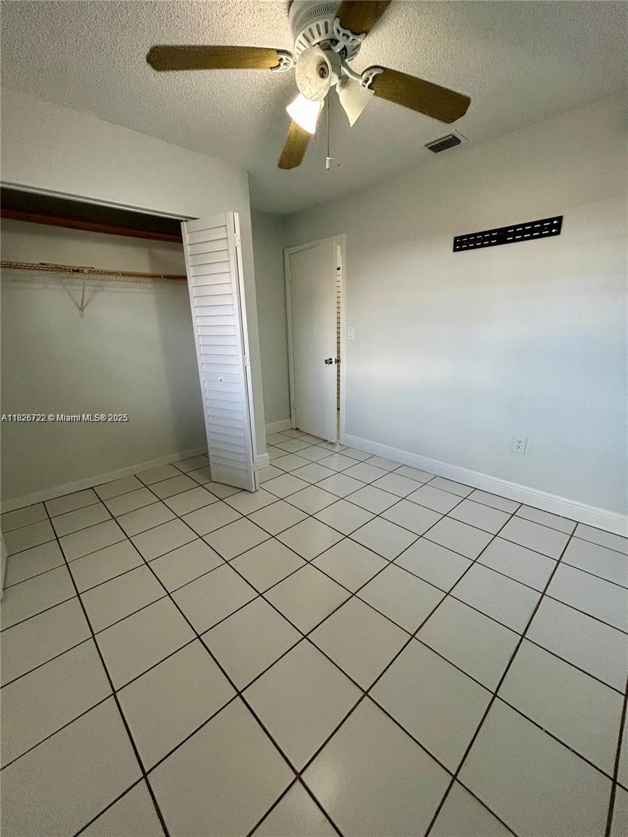 Cozy 2-bedroom, 1-bath townhouse with a functional layout featuring a kitchen, dining room, and living room. Includes in-unit washer and dryer. Front patio offers space for casual entertaining. Conveniently located within 15 minutes of shopping centers, neighborhood parks, and Hard Rock Stadium. Owner occupies an efficiency unit on the property but maintains a low presence.