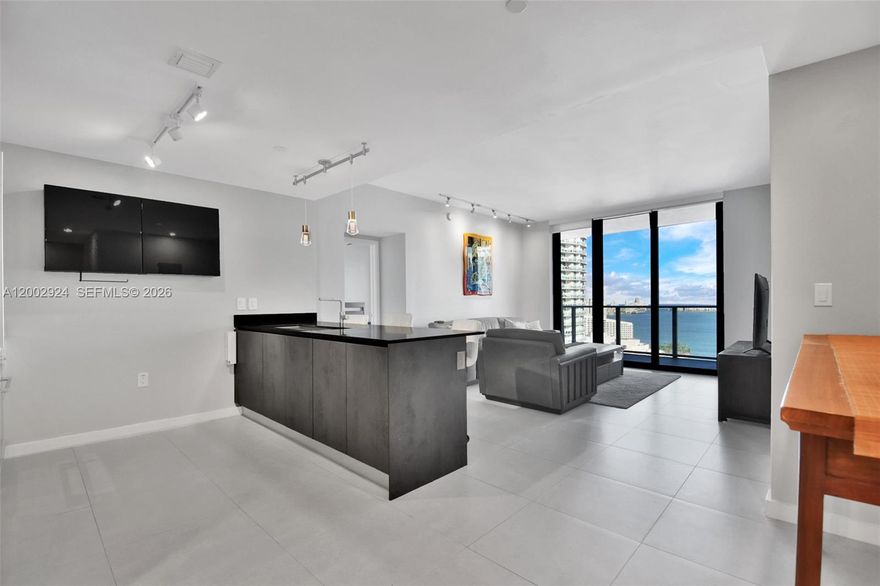 Spacious and fully furnished 2-bedroom, 3-full bath condo available for rent in one of Brickell top buildings. This unit features a private elevator that opens directly into the living area, a large den with its own full bathroom — perfect for a home office or studio — and an oversized balcony with lounge chair, an outdoor dining table, and access from both bedrooms, offering incredible views of the Brickell skyline and Biscayne Bay. The building’s amenities include indoor and rooftop pools, a Turkish hammam spa, sauna, steam room, gym, half basketball court, squash court, a running track around the building, and even virtual golf and bowling.