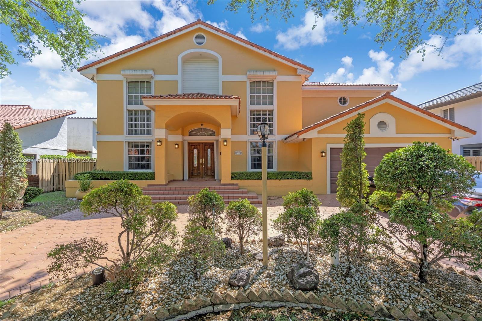 Your future home awaits in the sought-after Royal Oaks community of Miami Lakes! This spacious 4-bedroom, 3-bath two-story estate welcomes you with volume ceilings, tons of natural light, a formal living room and dining room, and vast commoan areas. One bedroom and full bath are conveniently located on the first floors. Step outside to your private backyard which offers a covered terrace and a sparkling pool. The home also has partial impact windows and accordion shutters. Nestled in a gated community and centrally located near major highways, top schools, shopping, dining, and places of worship, this home offers the perfect blend of lifestyle, privacy, and convenience.