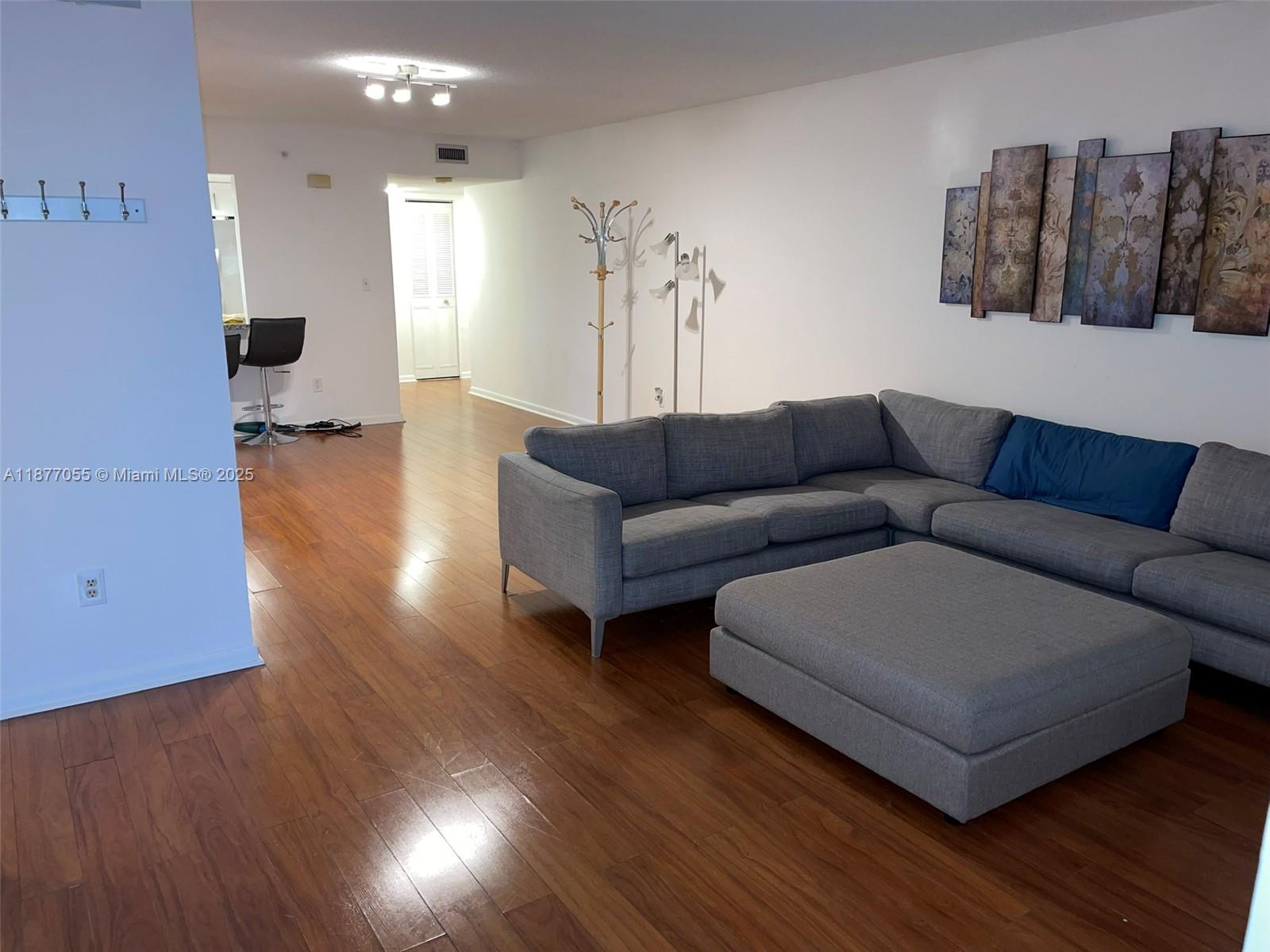 Great Price! Washer & Dryer In Unit and 1 Assigned Parking Space + Guest Parking! Bright & spacious 3 Bedrooms and 2 Full Bathrooms, corner unit with central AC and impact windows. Oversized master with walk-in closets & double sinks. Large screened balcony overlooking the lake & pool area. Ample storage, plenty of parking & guest parking. Located in the desirable "Lake View of California" gated community