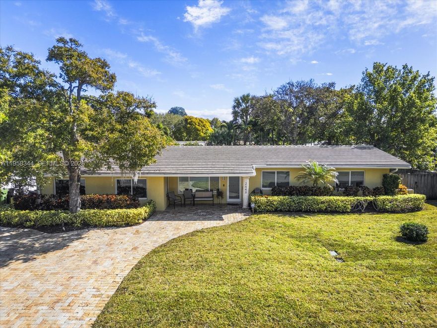 ENHANCED VALUE -NEW PRICING -Set on a beautifully maintained, tree-lined street in prestigious Coral Ridge, this exceptional 5-bedroom home offers bright, open living designed for today’s families. Sun-filled living, dining, and family rooms flow seamlessly to a lush, manicured backyard with a sparkling pool—ideal for entertaining, play, and everyday enjoyment. The oversized primary suite features a spacious walk-in closet, and ample storage is found throughout the home. Recent upgrades include a newer roof (2022), pool pump (2022), new flooring in most areas, remodeled secondary bathrooms, and hurricane impact windows throughout. Just moments from George English Park, beaches, and top-rated schools, this private and welcoming residence delivers outstanding value in the A-Rated Bayview School District