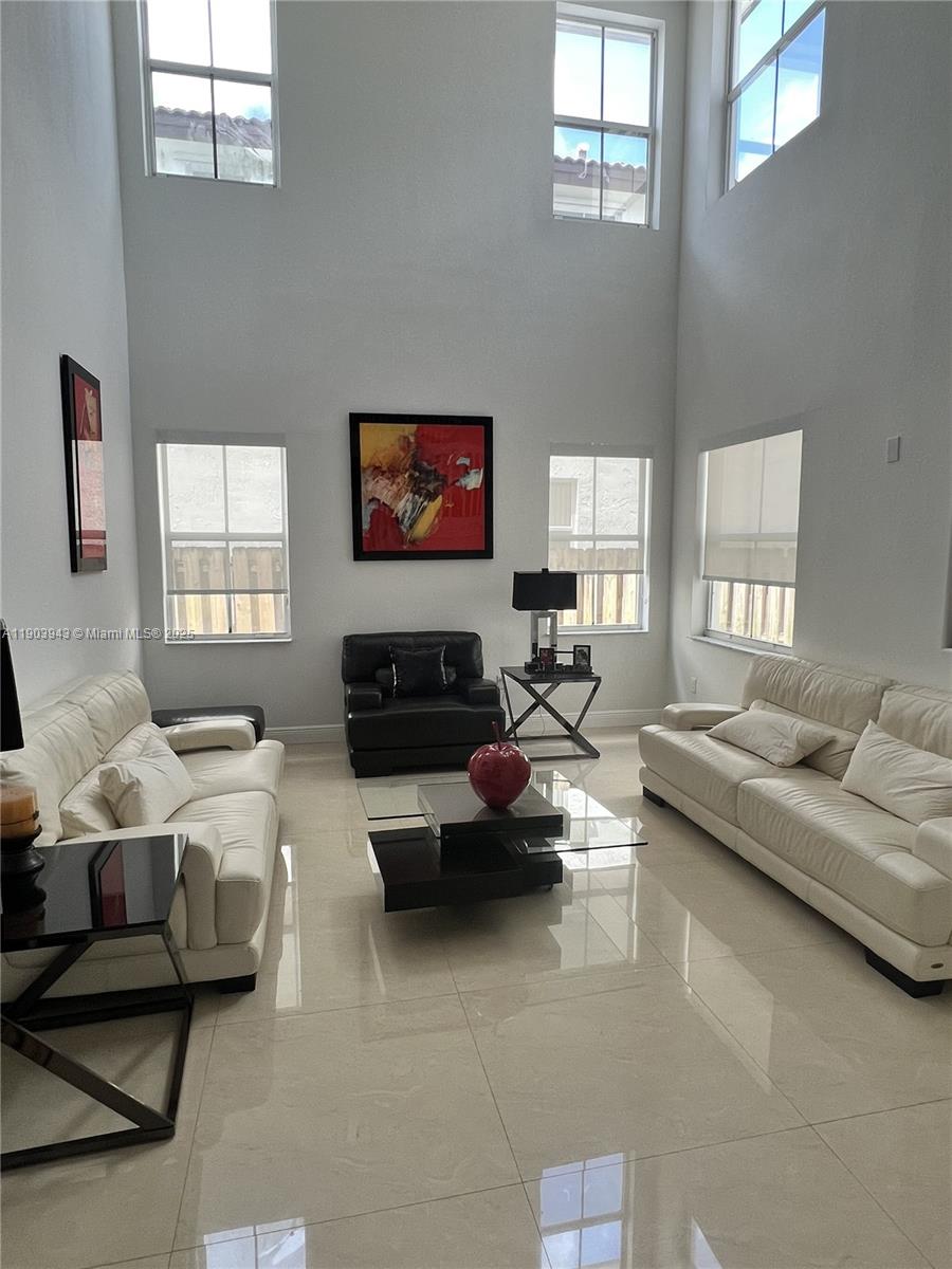 Porcelain and wood floors,remodeled bathrooms.Kitchen with stainless steel appliances & granite counter tops, formal living and dining. Nice patio for entertainment. One bedroom and full bathroom downstairs.