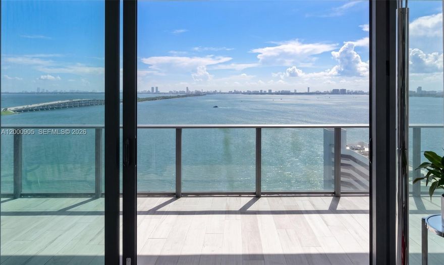 Perched on a high floor at Gran Paraiso, Residence 1501 is a spectacular 4-bedroom, 4.5-bath waterfront home offering unobstructed Biscayne Bay views and stunning Miami Beach skyline vistas. This bright and airy residence features a highly desirable flow-through layout with triple exposure, allowing for both breathtaking sunrises and sunsets from the expansive wraparound terrace.

Floor-to-ceiling glass floods the interiors with natural light, highlighting refined finishes throughout, including wood-look ceramic flooring and a sleek open kitchen equipped with premium appliances. The spacious primary suite offers direct terrace access and a spa-inspired bathroom with dual vanities, soaking tub, and separate glass-enclosed shower. Each additional bedroom is en-suite, ensuring comfort and privacy for family or guests.

A private elevator opens into an exclusive foyer, adding an extra layer of privacy and sophistication. Additional features include dual-zone A/C and ample storage.

Residents enjoy world-class amenities shared with Paraiso Bay, including a waterfront pool, state-of-the-art fitness center, spa, tennis courts, bowling lanes, kids’ play areas, on-site dining, and 24-hour concierge and security. Ideally located in the heart of Edgewater, minutes from Miami Beach, Design District, Wynwood, and the airport.