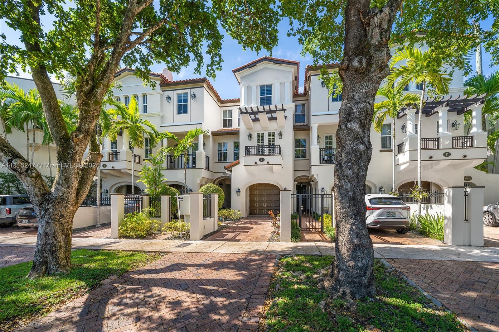 The best of urban living amongst tree-lined Gables streets! Located in the Villas at Santander, this 4-bed, 3.5-bath townhome offers comfort, and convenience just blocks from Downtown Coral Gables, the Biltmore, Coral Gables Library and Youth Center. Enjoy the outdoors with a private courtyard and lush treetop views from 3 balconies. Inside, marble floors, updated kitchen w/ quartz counters, elevator, and washer/dryer make for easy living. Additional features include a 1-car garage, private driveway, and impact windows & doors. The spacious layout includes a bedroom & bathroom on the 1st floor, bright living spaces on the 2nd, and a primary suite + two bedrooms on the third. Just 15 mins to MIA, zoned for GW Carver Elementary, and surrounded by multi-million dollar homes!