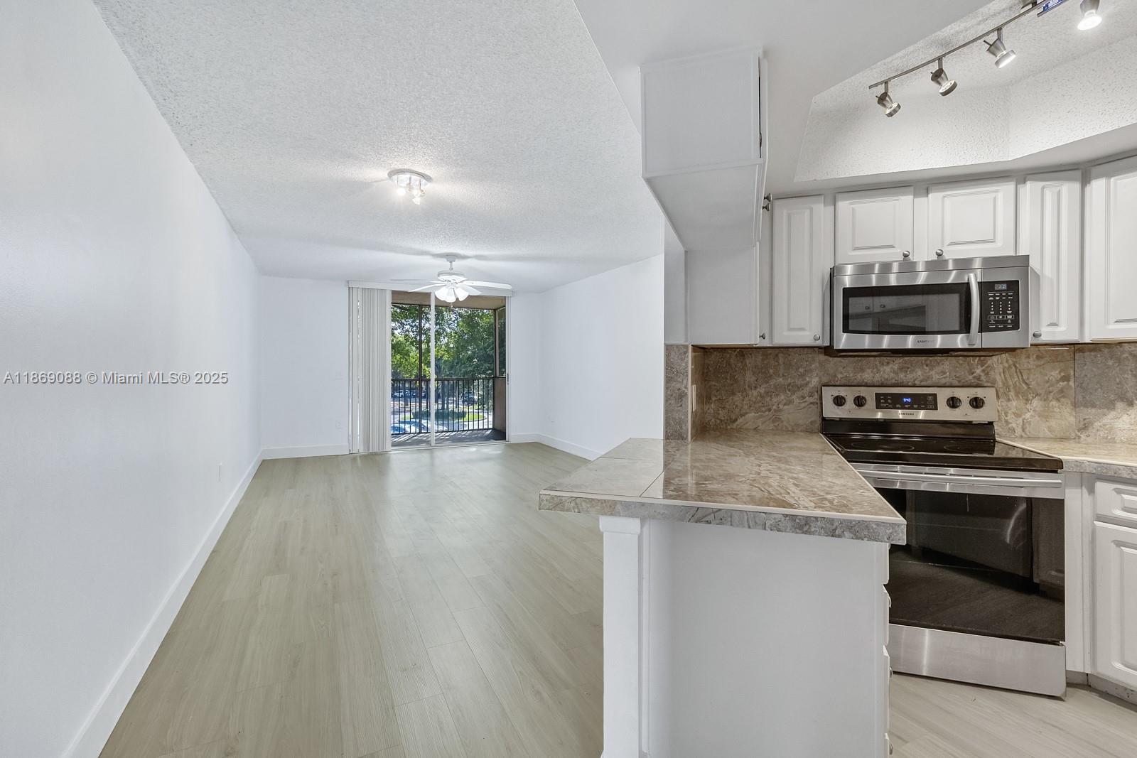Living in an updated, centrally located condo doesn't have to be expensive. Welcome to Las Vistas in Doral. This unit is perfect for the busy individual who appreciates a modern and quiet sorrounding where they can sit back with drink in hand and enjoy the time away from the hustle of the work week. Elegantly updated this condo has what you may be looking for: updated: flooring, bathroom, kitchen, lighting, etc. If indeed size matters, look no further, this unit feels and is bigger than some 2 bedroom listings and it is still a 1 bedroom. Don't settle for less.