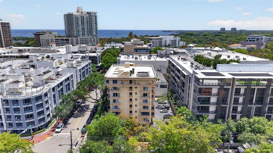 Beautiful Coconut Grove, next to Cocowalk and located directly in the heart of the village. VERY low price for a 2 bedroom unit in the Grove. Light and bright 2 bedroom, 2 bath condo with two very spacious balconies.  Updated condo with open floor plan. Owner agrees to pay Special Assessment at closing. 50 year certification being planned for immediate commencement.