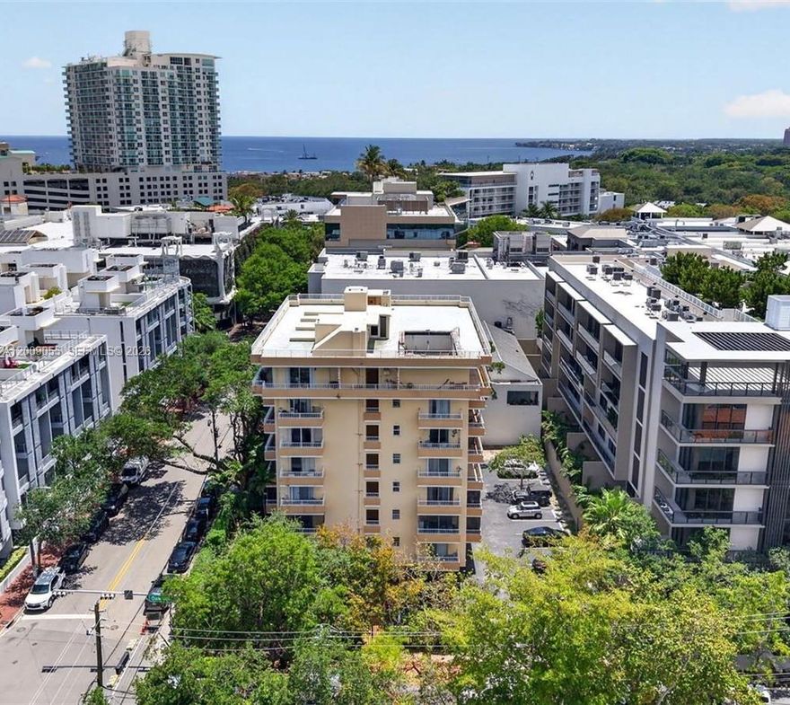 Beautiful Coconut Grove, next to Cocowalk and located directly in the heart of the village. VERY low price for a 2 bedroom unit in the Grove. Light and bright 2 bedroom, 2 bath condo with two very spacious balconies.  Updated condo with open floor plan. Owner agrees to pay Special Assessment at closing. 50 year certification being planned for immediate commencement.