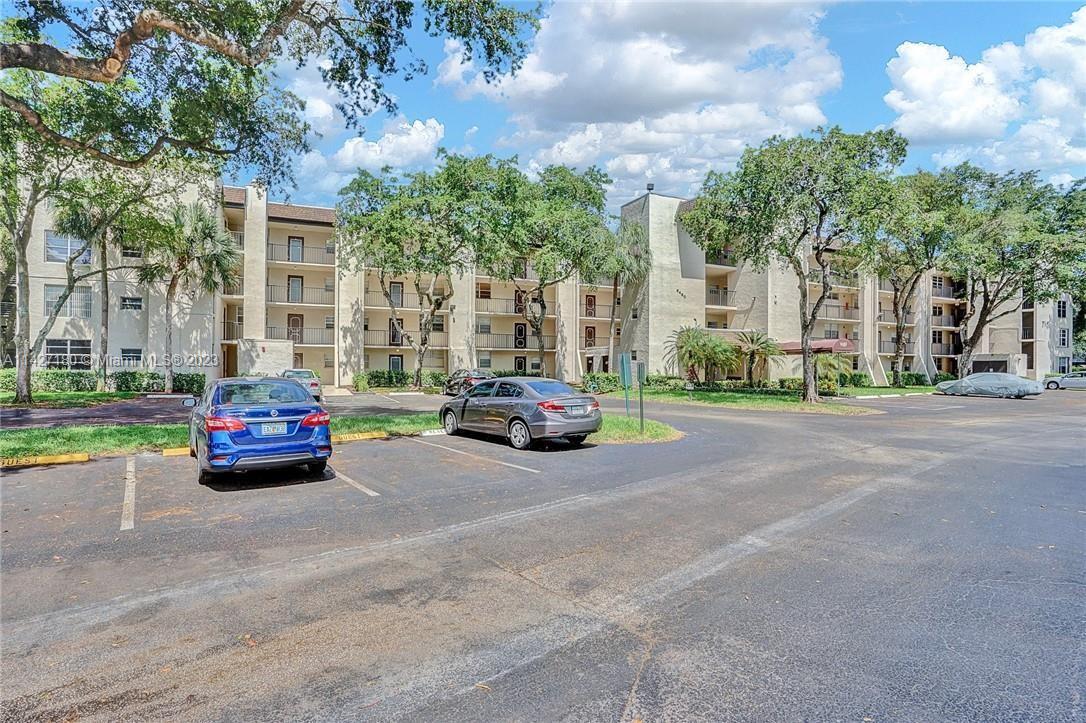 Located in the sought-after GOLF COURSE COMMUNITY of Pine Island Ridge w/HIGH RATED SCHOOLS, tree-lined streets, Country Club with 2 restaurants, & much more~This CORNER TOP FLOOR UNIT features FULL IMPACT WINDOWS, SLIDERS, & DOORS~TANKLESS HOT WATER HEATER~Newly screened patio w/view of the golf course and water~HUGE STORAGE AREA~CLOSETS GALORE w/master enjoying his & her's closet~Crown molding~3rd bedroom converted to dining room however could be easily converted back~Community laundry room on each floor w/2 W &D's~Association requires minimum 650 credit score~Pet friendly up to 20 lbs~Association dues are $581.01 plus $81.49 special assessment (total $662.50) monthly & $175 per year for dining card to be used in country club restaurants~Community playground is in process of renovation