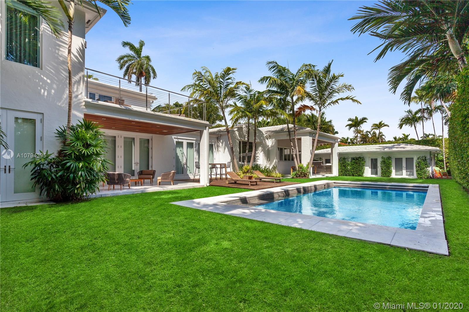 Fully remodeled 2-story gated home with detached guest house situated on a double lot on prestigious North Bay Road in Miami Beach. Smart home with Savant system, Lutron lighting, hurricane-impact windows & whole-home generator. Main House features 5 bedrooms, 4.5 bathrooms, custom Henrybuilt eat-in kitchen with chef's island & Miele appliances, formal living room with cathedral-beamed wood ceilings, formal dining room, theater, executive office & spacious master suite with terrace & spa-like bathroom with Jacuzzi tub & glass shower. Guest House offers 2 bedrooms, bathroom & kitchenette. Expansive backyard with manicured green space, covered patios, summer kitchen, dining & swimming pool with electric convertible cover. Private lush mini park for kids and/or pets & 2-car attached garage.