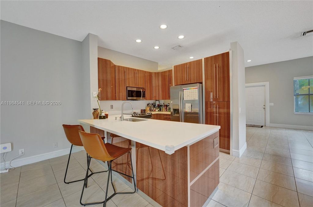 Photo of 930 Bluewood Ter, Weston, FL 33327 (MLS # A11984541)