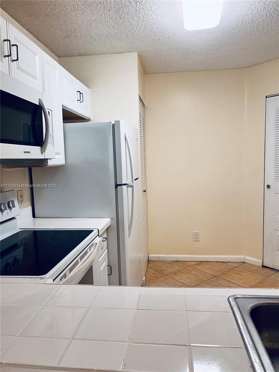 NAPOLI GARDENS AT CORAL S - Residential
