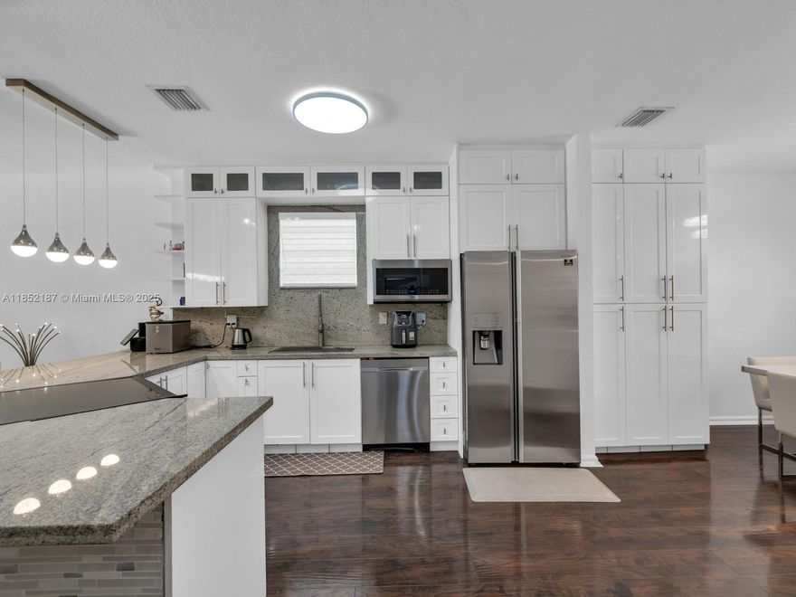 Fully renovated 4 bedroom, 2.5 bath pool home in the heart of highly desirable Cutler Bay, a golf-cart friendly community just minutes from Black Point Marina. Step inside with soaring ceilings, abundant natural light, designer wood flooring. The custom open-concept with fully renovated white shaker kitchen featuring granite countertops, stainless steel appliances, ample prep space ideal for entertaining. The ground-level master suite with newly renovated bathroom. Upstairs, you’ll find 3 spacious bedrooms plus a versatile loft that can easily be converted into a 5th bedroom, office or playroom. Enjoy South Florida living in the private backyard oasis, covered terrace, natural stone patio & sparkling custom pool, perfect for family gatherings & weekend fun.This home truly checks every box.