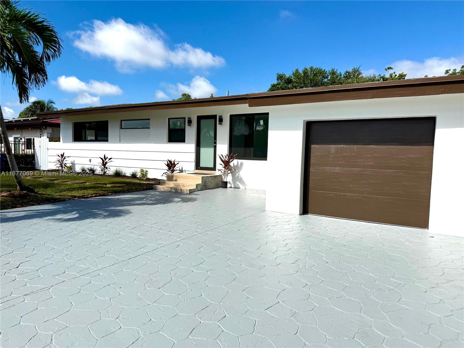 Beautifully renovated 3-bedroom, 2-bath single-family home in the heart of North Miami, just minutes from Aventura Mall and I-95. This home features a modern open-concept design with a brand-new kitchen, quartz countertops, custom cabinetry, and stainless steel appliances. Spacious living areas with elegant porcelain tile floors throughout. The bathrooms have been completely updated with contemporary finishes. Enjoy a large private backyard with a sparkling pool, perfect for entertaining or relaxing. The property also includes a one-car garage, a private driveway with ample parking, and new landscaping. Prime location in a quiet residential neighborhood, close to shopping, dining, beaches, and top schools. Move-in ready!