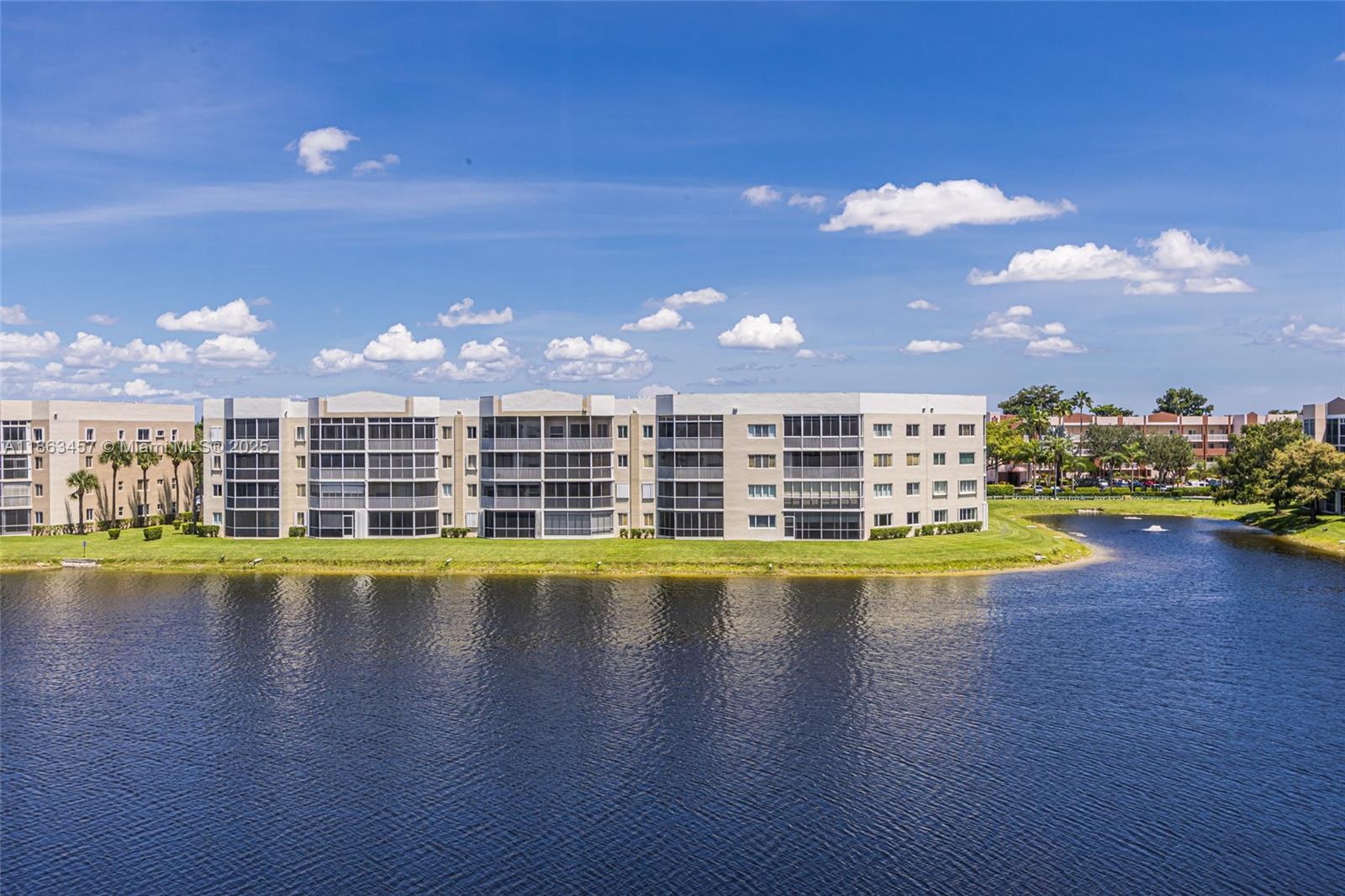 This fabulous 2 bedroom/2 bath condo in the desirable Trent community in Kings Point offers beautiful lake views from the screened balcony with acrylic sliders and storage closet. This unit is immaculate and move in ready. White kitchen with SS & quartz counters. Tile & laminate floors are throughout. For your convenience, there is a full size washer/dryer in unit. You will appreciate the high ceilings in this 4th floor unit. Updated bathroom. Close to the elevator. It's an easy walk across parking lot to the Trent satellite clubhouse and pool. Located in this 55+ community, enjoy the incredible amenities that Kings Point offers. Heated indoor pool, courtesy bus, huge clubhouse, theater, gym, billiards, pickleball, 60+ clubs and more. Some furniture negotiable. OK rent after 2 years owned.