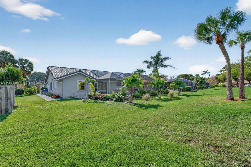 Beautifully updated POOL home located near Coral Springs & backing up to a serene city PARK to enjoy both privacy & accessibility in one of the most desirable neighborhoods. Open-concept split floor plan w/ vaulted ceilings & abundant natural light. Upgraded kitchen w/ 42” shaker-style cabinets, granite counters & stainless appliances. Wood & stone-look tile & laminate flooring throughout. Both bathrooms completely remodeled w/ luxurious, spa-inspired design. Additional upgrades include a BRAND NEW S-TILE ROOF, SOLAR PANELS for Electric Bills under $40/MTH & full accordion shutters! Newer Carrier A/C unit, upgraded sprinklers. Relax or entertain in the volume SCREENED-IN POOL area, complete w/ covered space for grilling & outdoor dining. Within the Coral Springs High School zone & minutes from top-rated restaurants, shopping centers, major highways & the beach, this home truly has it all!