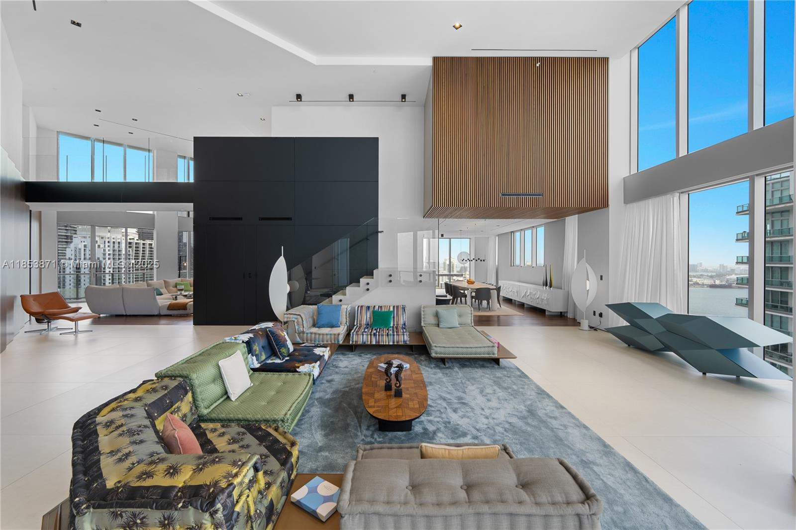 EXQUISITELY REDESIGNED TWO-STORY PENTHOUSE BY TOGU DESIGN & MASTERFULLY EXECUTED BY SABAL LUXURY BUILDER IN THE HEART OF BRICKELL! Encompassing 6,521 SF of Interiors this Smart Home wrapped in Bay & City Views offers 5 Bedrooms + 6 Baths + 2 Powder Rooms w/Office, Gym & Theater. Soaring 20-foot Ceilings & Floor-to-Ceiling Impact Glass w/sweeping Water Views. Rich Black Walnut Flooring throughout. Residence features Open-Concept Chef’s Kitchen w/premium appliances + a Separate Prep Kitchen. Expansive Primary Suite w/Oversized Spa-like Bath & Custom California Closets. State-of-the-Art Savant Automation System. Building Amenities include Rooftop Pool & Sundeck, 50FT Lap Pool, Owner’s Lounge, Fitness Center. Located in the Epicenter of Brickell w/World-Class Dining, Shopping + Nightlife.