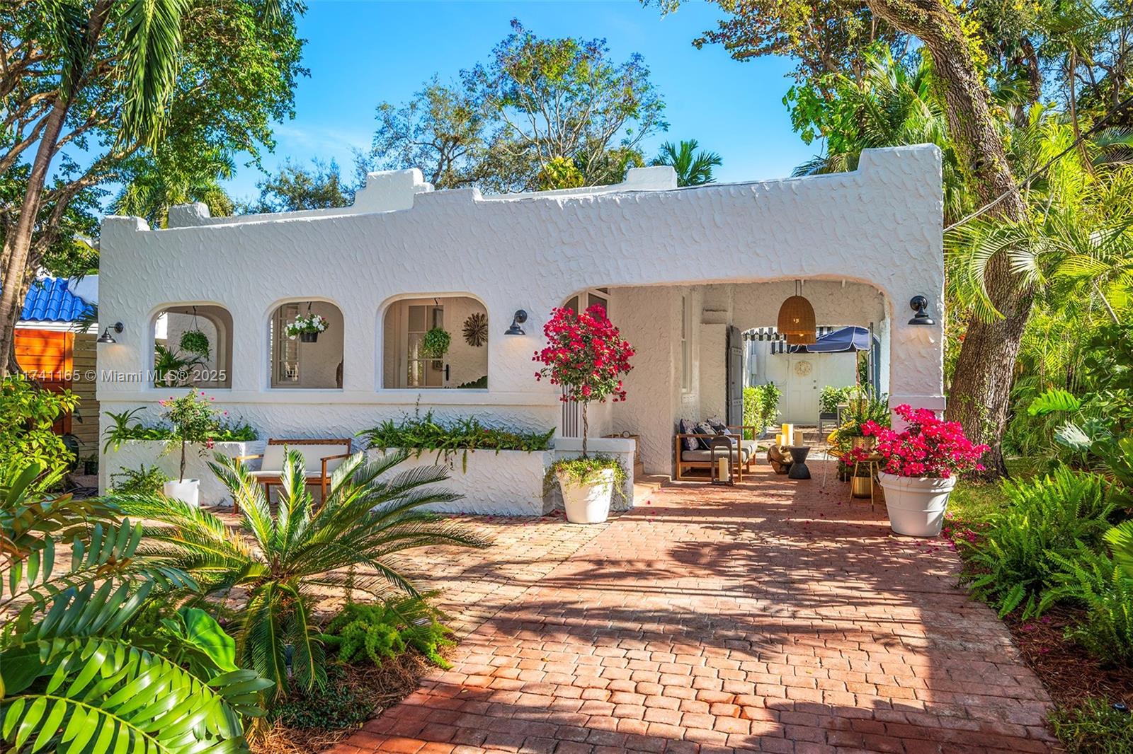 Discover this captivating gem nestled in the heart of prestigious North Coconut Grove. This wonderful place to call home exudes authentic originality and embodies the archetypical old-grove character that makes this neighborhood so cherished. Experience the perfect blend of timeless charm and serene living in one of Miami's most sought-after locations.