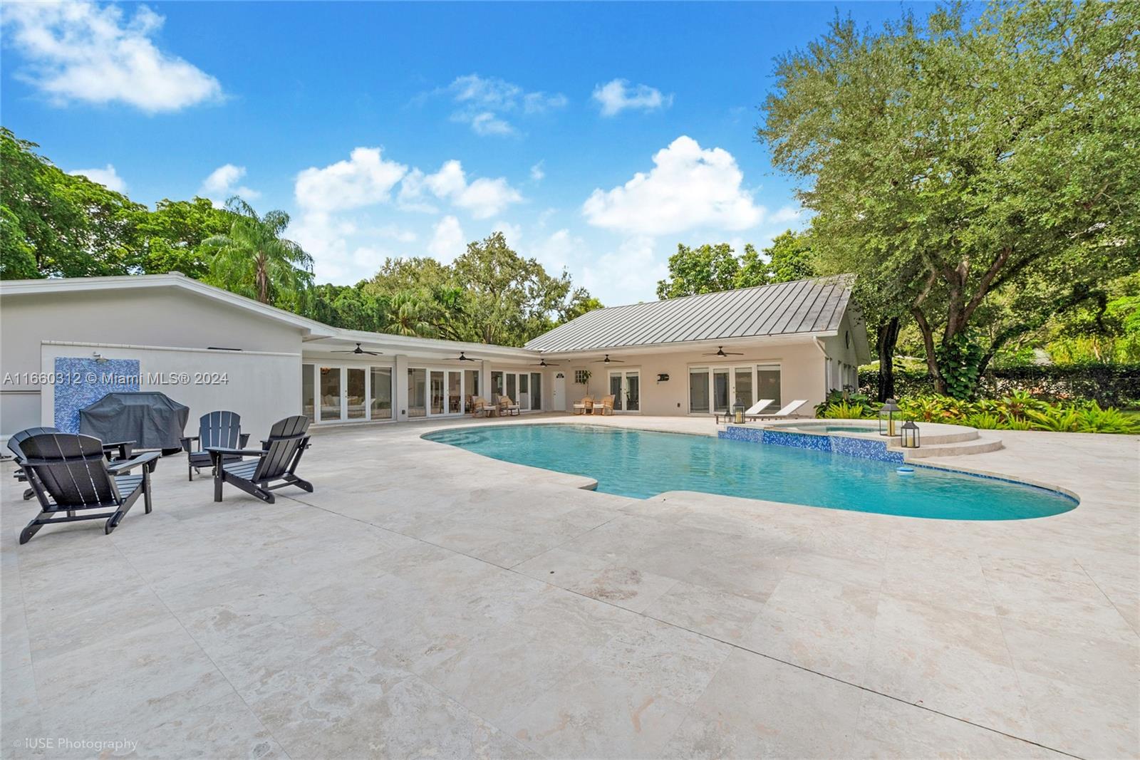 Nestled in N. Pinecrest on one of the area’s most narrow, tree-canopied streets, this stunning home offers ultimate privacy and charm. Priced close to its purchase price from two years ago, it includes remodeling plans and a design book to transform it into a modern California-ranch style oasis. The home boasts 6 bedrooms, 4 full baths, a beautiful Florida room with French doors leading to the pool & spa, a covered gazebo with wet bar, and lush gardens with majestic oaks. Features include a cabana bath, gated 2-car garage, and two primary bedrooms in separate wings with private entrances.