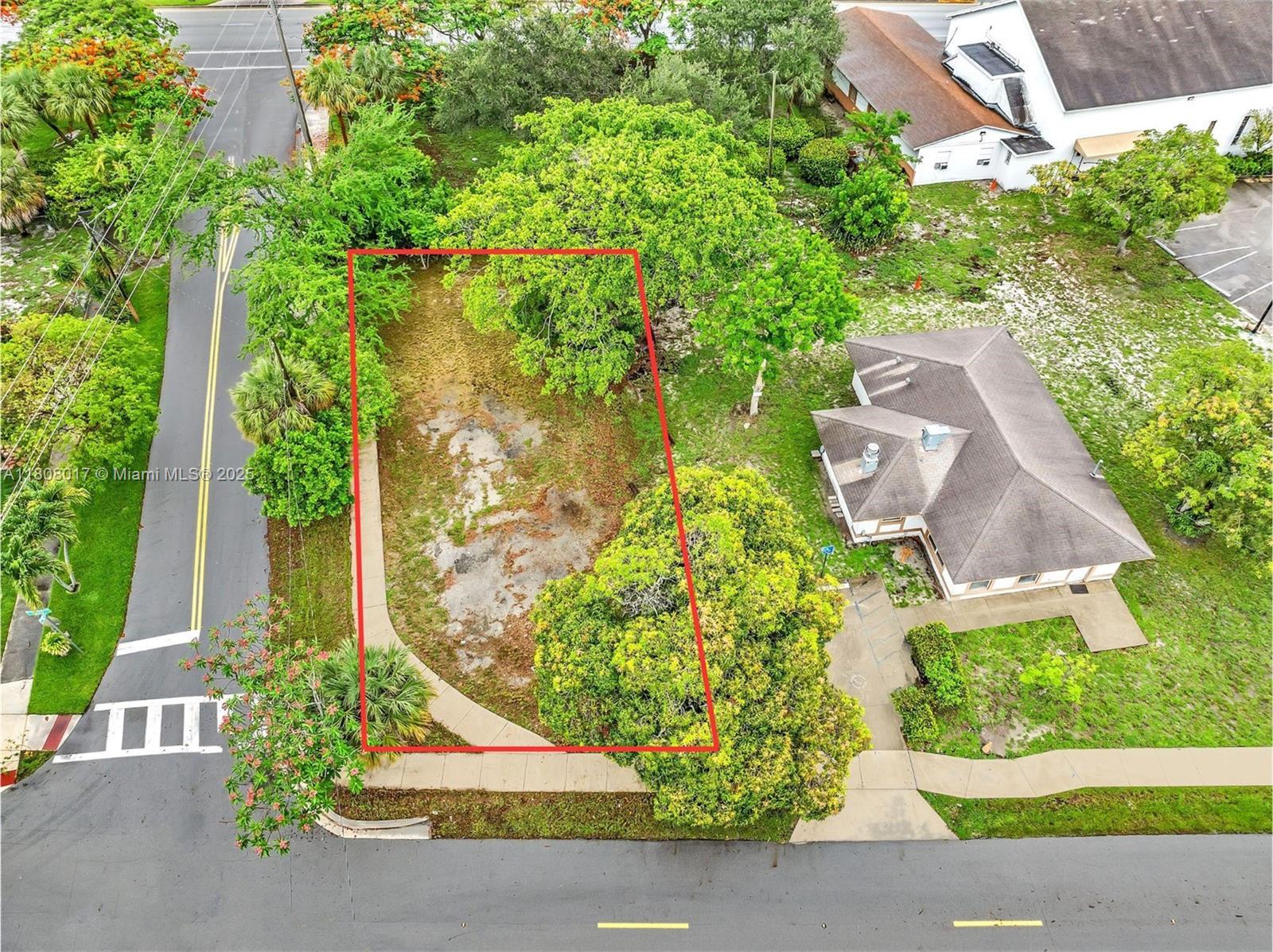 BACK ON MARKET - Rare opportunity in Deerfield Beach, Broward County! Vacant corner lot zoned Dixie Business/Residential, just minutes from the beach, shopping, dining, schools, major highways, and I-95. A mango fruit tree sits at the edge of the property, offering shade and fresh fruit. An excellent opportunity for single family, investors, builders, or business owners in a growing area. Drive by and envision the possibilities!