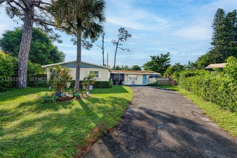 Photo of 851 Caroline Cir, West Palm Beach, FL 33413 (MLS # A12103975)