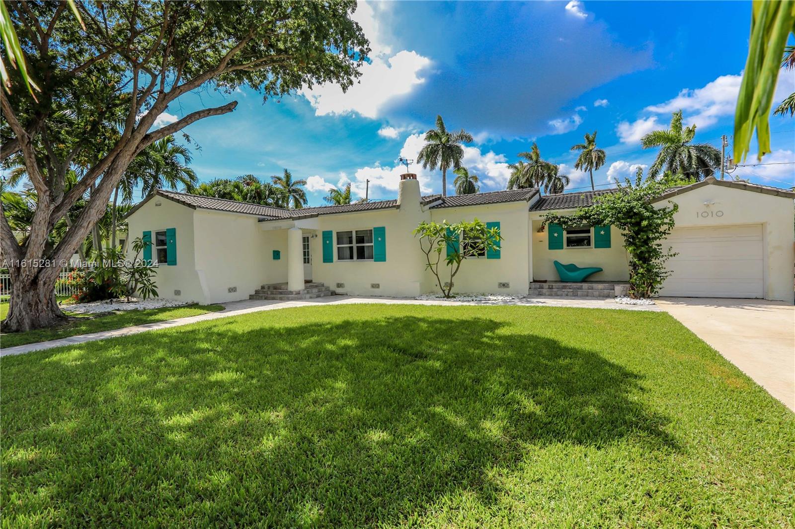 Welcome to Sunshine Cottage in Hollywood Lakes!One of the most exclusive locations in Hollywood Lakes with wide streets, royal palms, and antique lighting.This home has an open-concept kitchen, lots of cabinet space, a big cooking Island with a farmer's sink, breakfast area, stainless steel appliances, a gas stove, a custom-made eating area, and a beautiful view of the pool through double doors.Vaulted ceilings, exposed wood beams, and fireplace. The primary bedroom features an open space together with a bath featuring a double sink, lots of storage cabinets, and a spacious shower with a frameless glass door. Impact windows and doors throughout! Beautiful saltwater pool, Spa, and outside shower. Cover Patio Features dining and seating area w/ outside kitchen to enjoy the outdoors living!