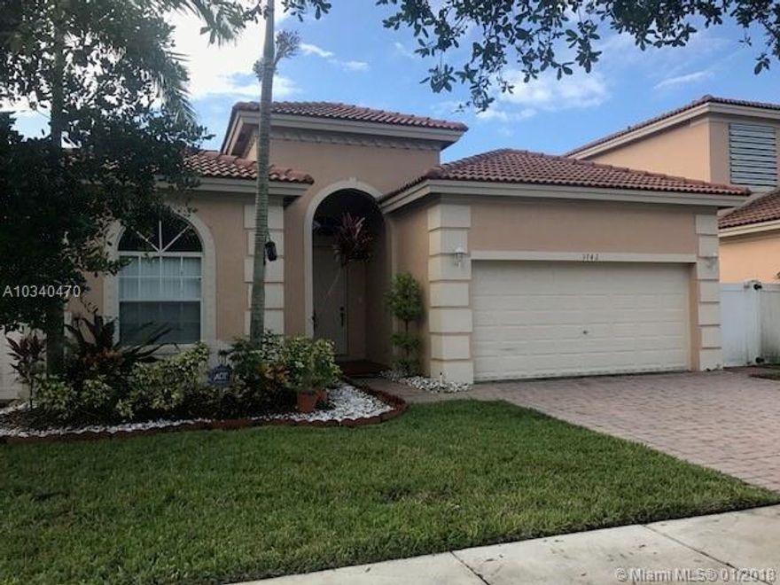 Gorgeous 3 bedroom home available in Waterstone! This property will not disappoint, and features a spacious layout, high ceilings, fenced yard, 2 car garage,  and screened in porch. All tile floors throughout, lots of closet space, and attached garage. Big open kitchen with island. Neutral colors throughout, Will not last!