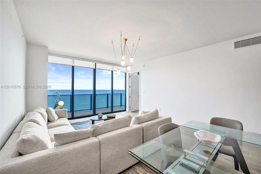 Residence 1904 at Casamar Pompano Beach offers sweeping ocean and intracoastal views from a desirable high floor. Decorator-appointed and fully furnished, this residence includes 3 bedrooms, 3.5 bathrooms, and a dedicated media room.  Private foyer entry. Move-in ready with an open layout, floor-to-ceiling impact glass, abundant natural light, motorized window treatments, and spacious sunrise and sunset terraces. The kitchen is equipped with premium appliances, sleek cabinetry, and an oversized island. The primary suite includes direct ocean views, a spa-style bath, and custom-built closets. Full-service beachfront building with concierge, resort pools with all-day sun exposure, beach service, fitness center, golf simulator, pickle ball courts, and more! Ideally located near dining, shopping, and entertainment in Pompano Beach.