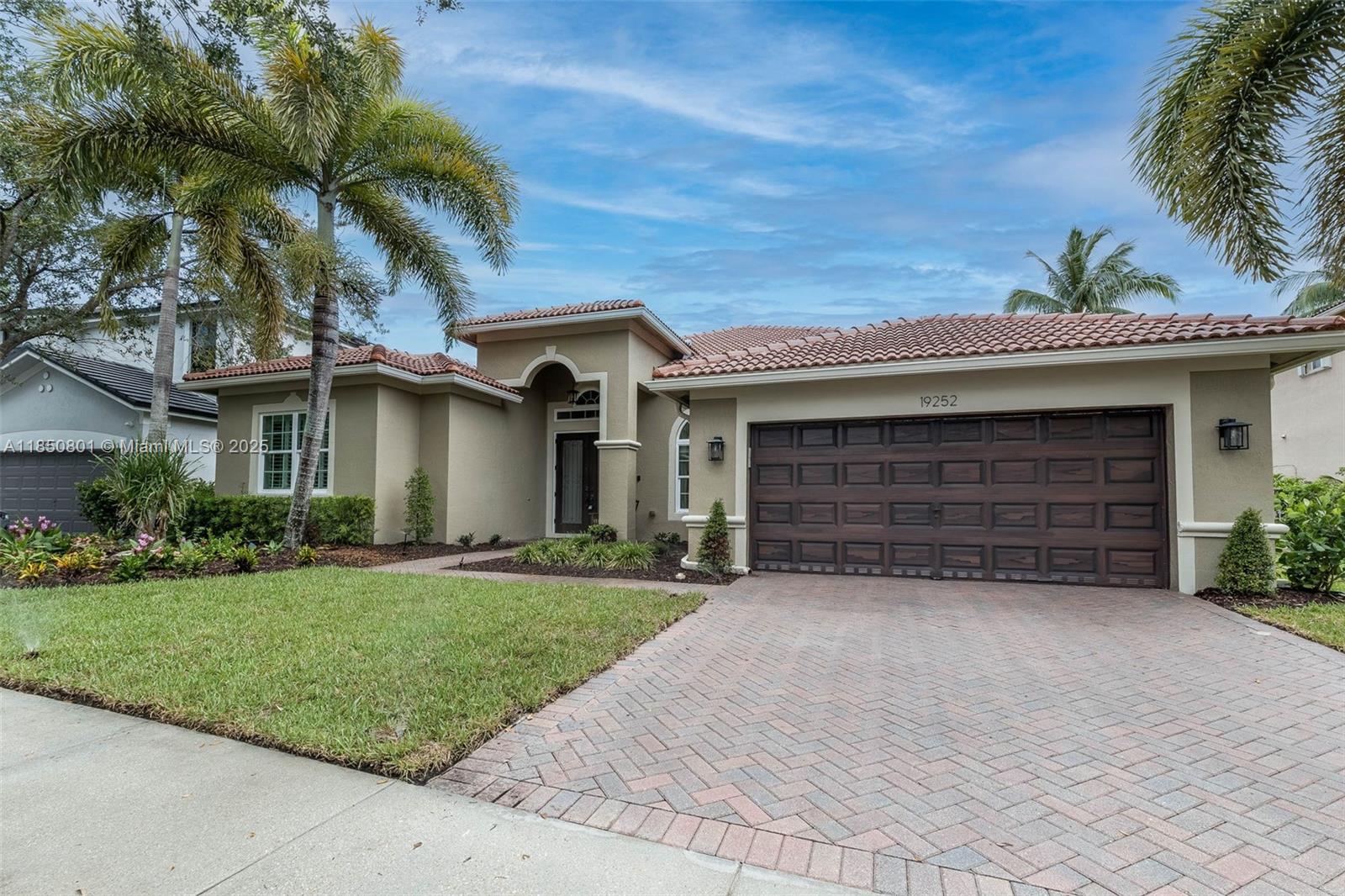 Step into this beautifully transformed lakefront and pool home in the sought-after Isles of Weston. Awaken each day to shimmering LAKE views from your elevated spa, perfectly poised above the sparkling heated, salt-water POOL. IMPACT windows and doors blend security with sleek design. Inside, the chef’s kitchen and spa-like bathrooms have been masterfully RENOVATED with the finest materials and craftsmanship. This elegant one-story offers a bright three-way split layout with 4 bedrooms and 3 baths—all enhanced by custom plantation shutters that add timeless charm.