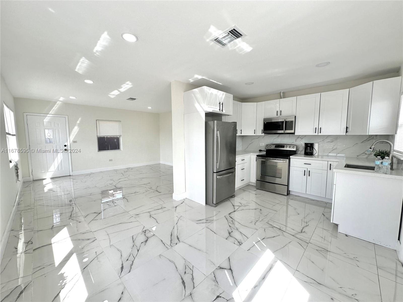 Buy and enjoy this beautifully renovated 3-bedroom, 2-bathroom home that blends style with comfort. Step into the bright, open-concept kitchen and living space, ideal for both daily living and entertaining. The home features spacious bedrooms, sleek tile flooring, and an abundance of natural light. The property is fully gated, offering privacy, while the expansive backyard provides a perfect space for gatherings, complete with a mature mango tree (leaning from the neighbours side). Conveniently located and move-in ready—this home is ready to charm you.