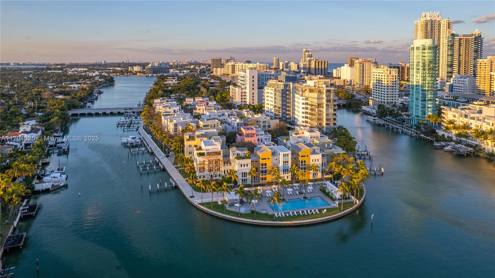 Welcome to an unparalleled opportunity to own the last trophy corner waterfront home on prestigious Aqua Island. This private and gated community epitomizes island living. A serene escape w/ water views & expansive waterfront terraces on every level. Enjoy mesmerizing sunsets that will take your breath away. With 4,500+ interior sqft this 5-bed, 5.5-bath w/ 7,000 total sqft, has 10’ ceilings, large art walls, natural light, rooftop, private elevator, 2 car garage, & atrium creating a harmonious blend of indoor and outdoor living. Residents have exclusive access to two pools, a spa, a 6,000sqft fitness center, concierge & 24-hour valet. One block from the ocean & walking distance to La Gorce. Set out to sea from your deeded dock & embrace the vibrant lifestyle that Miami Beach has to offer.
