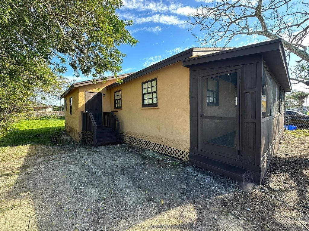 Photo of 125 SW 11th Ave, South Bay, FL 33493 (MLS # A11834515)