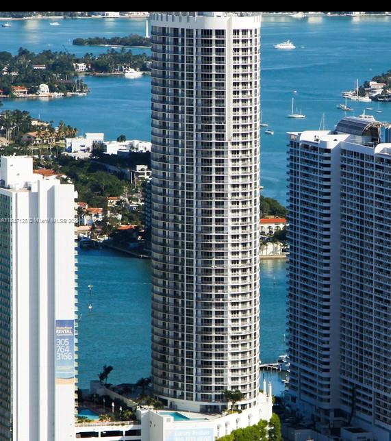 Spacious and bright 1- BED, 1-bath 825 sq ft located on the 36th floor of Opera Tower in Edgewater. This modern condo features an open kitchen with granite counter-tops, stainless steel appliances, floor-to-ceiling impact windows, in-unit washer and dryer, and a private balcony with stunning views of Biscayne Bay and the city. BUILDING offers resort-style amenities pool, gym, hot tub, business center, 24-hour concierge, valet parking, and on-site convenience services. Prime location across from Margaret Pace Park and just minutes from Wynwood, Midtown, Brickell, and South Beach. For showings use showing assist