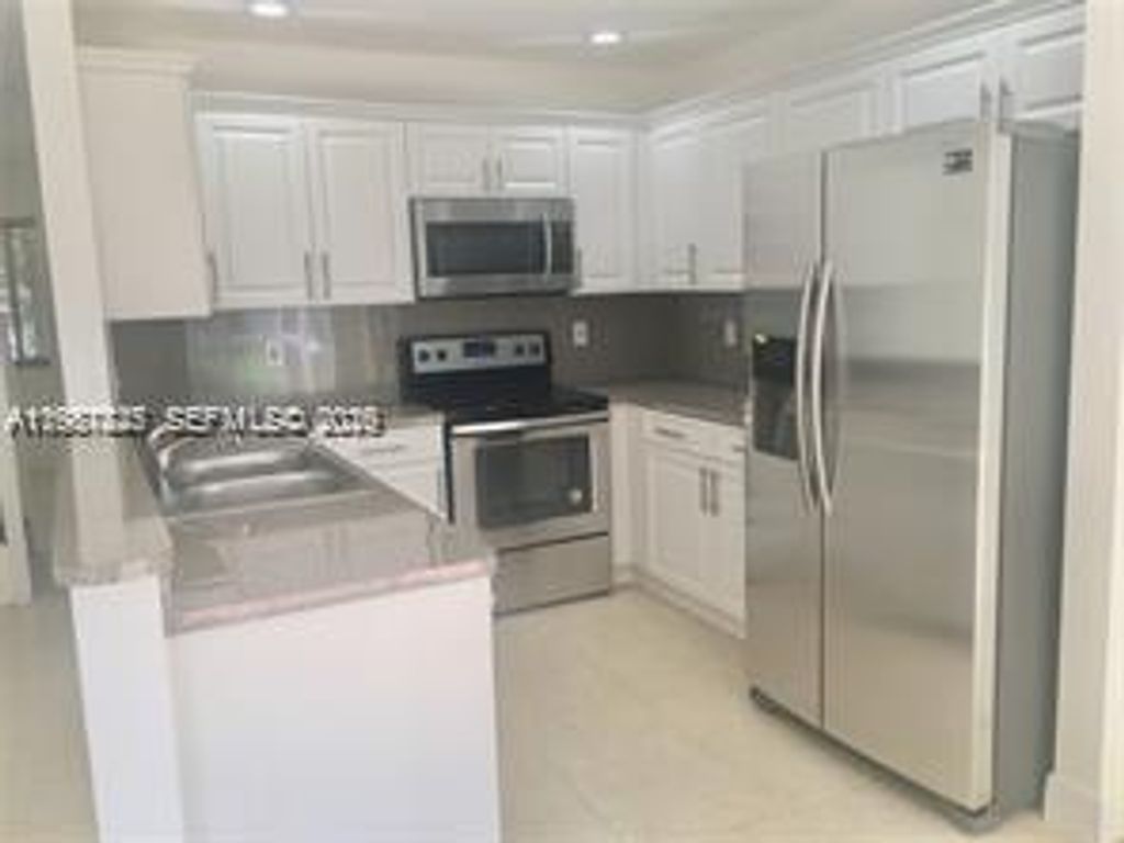 Photo of 833 NW 208th Ter #833, Pembroke Pines, FL 33029 (MLS # A11987825)