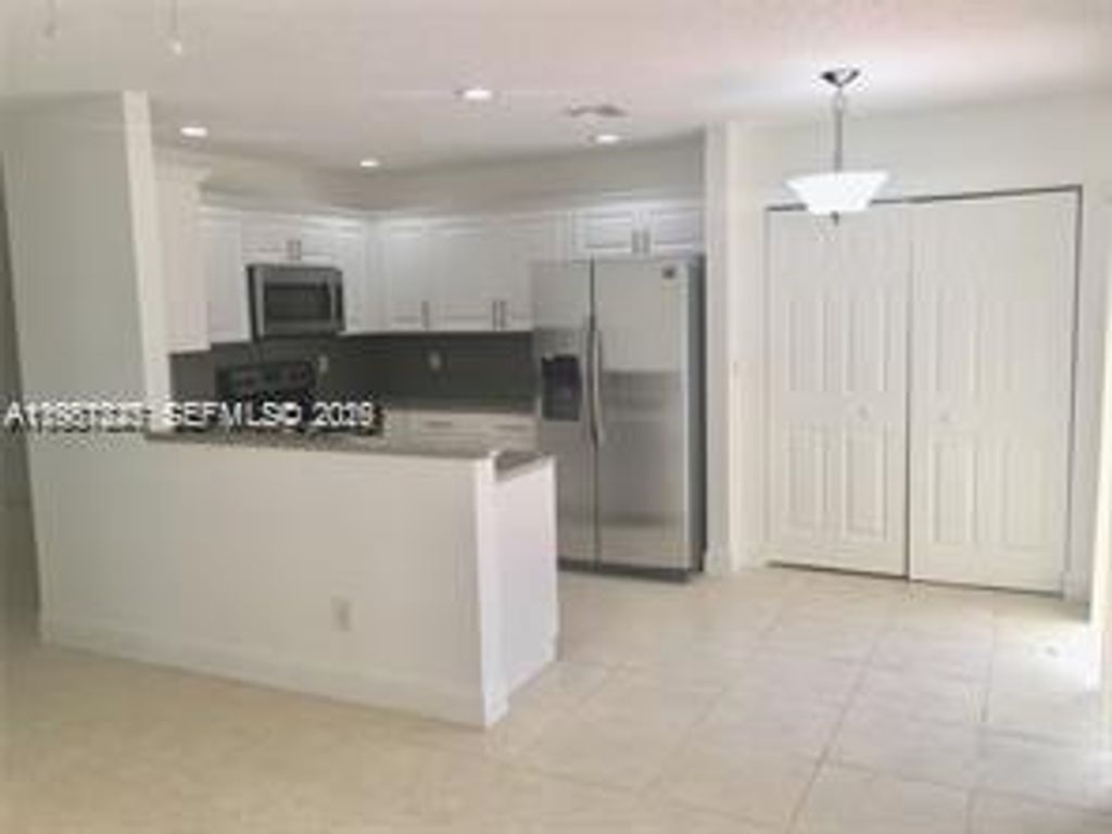 Photo of 833 NW 208th Ter #833, Pembroke Pines, FL 33029 (MLS # A11987825)