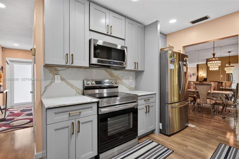 Photo of 6719 NW 70th Ct, Tamarac, FL 33321 (MLS # A11986399)