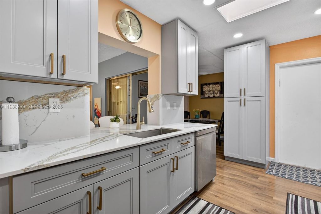 Photo of 6719 NW 70th Ct, Tamarac, FL 33321 (MLS # A11986399)