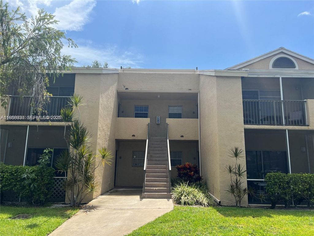 Photo of 660 Cypress Club Way #G11, Deerfield Beach, FL 33064 (MLS # A11988934)