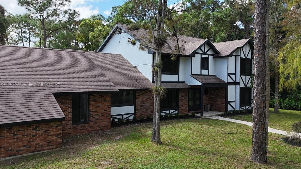 Photo of 12986 Marcella Blvd, Loxahatchee, FL 33470 (MLS # A11903533)